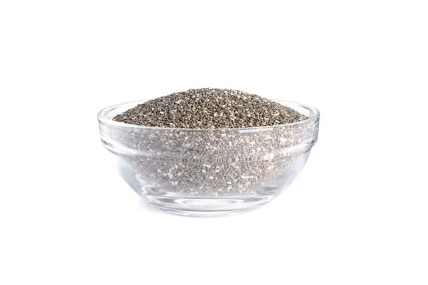istock Chia seeds in glass bowl isolated on white background 1181407943