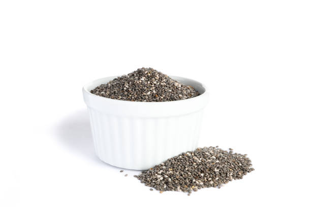 istock Chia seeds and sauce boat isolated on white background 1181408074