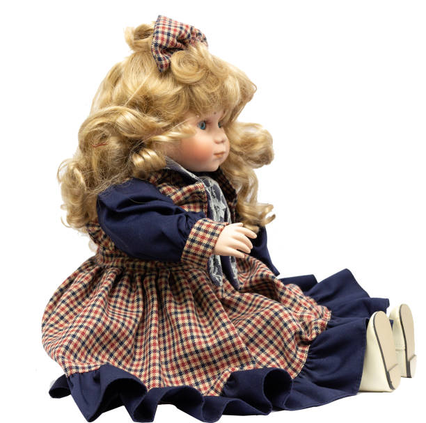 istock Ceramic porcelain handmade vintage doll, isolated on a white background. 1181408560