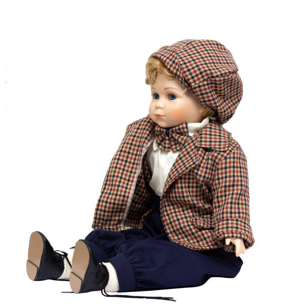 istock Ceramic porcelain handmade vintage doll, isolated on a white background. 1181408612