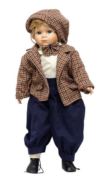 istock Ceramic porcelain handmade vintage doll, isolated on a white background. 1181408648
