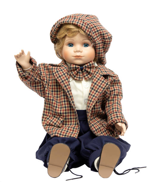 istock Ceramic porcelain handmade vintage doll, isolated on a white background. 1181408688