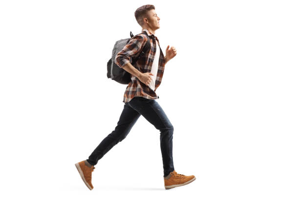 istock Male teen student running 1181409691