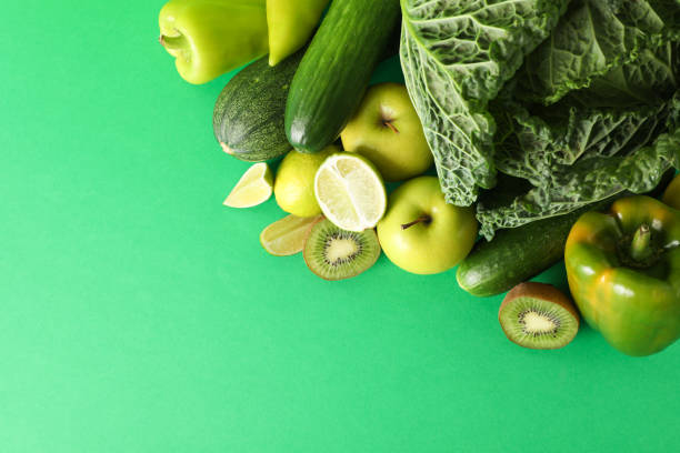 istock Vegetables and fruits on green background, copy space 1181410011