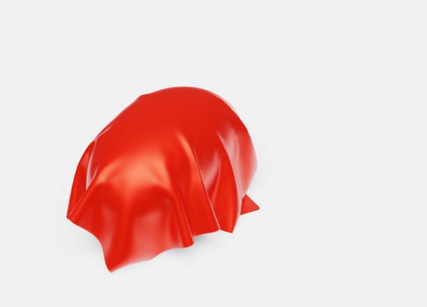 istock One Rugby Ball under a Red shiny Fabric piece 1181411698