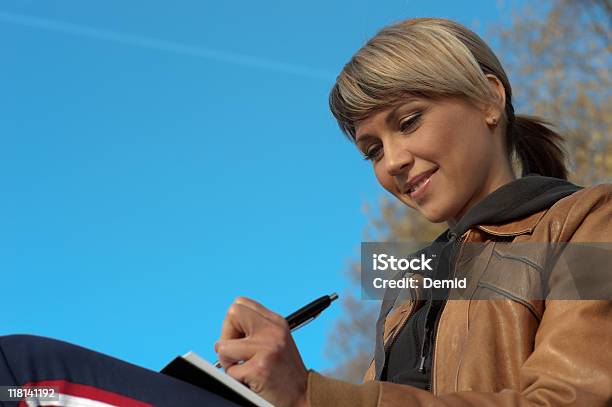 Lady Writing Outdoors Stock Photo - Download Image Now - Activity, Adult, Adults Only