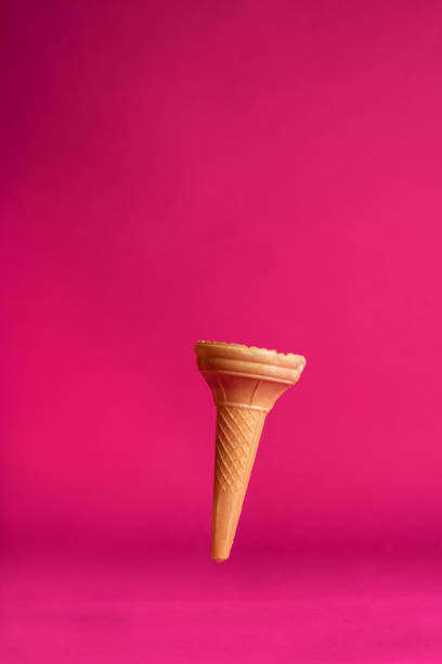 istock Sweet wafer ice cream cone isolated on pink background. 1181413007