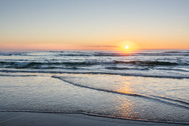 istock sunset or sunrise at the beach 1181413017