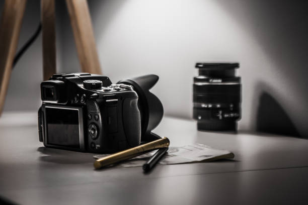 istock Digital Camera and Camera Lens on the white background 1181413174