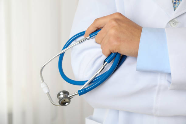 istock Doctor holds a stethoscope, close up and space for text 1181414384