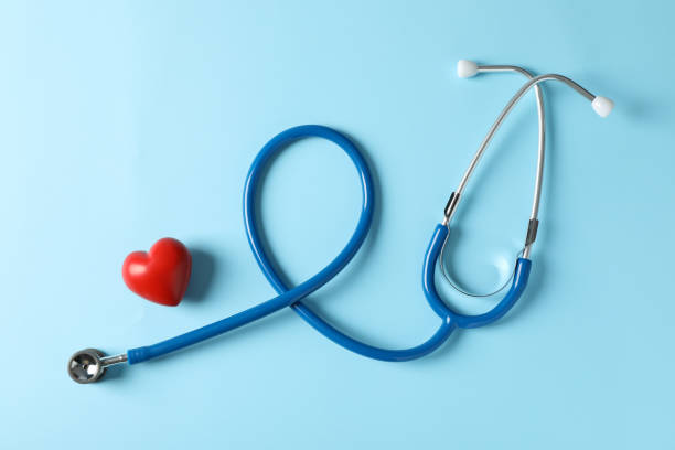 istock Stethoscope and heart on blue background, top view 1181414612