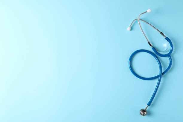 istock Stethoscope on blue background, top view and space for text 1181415923