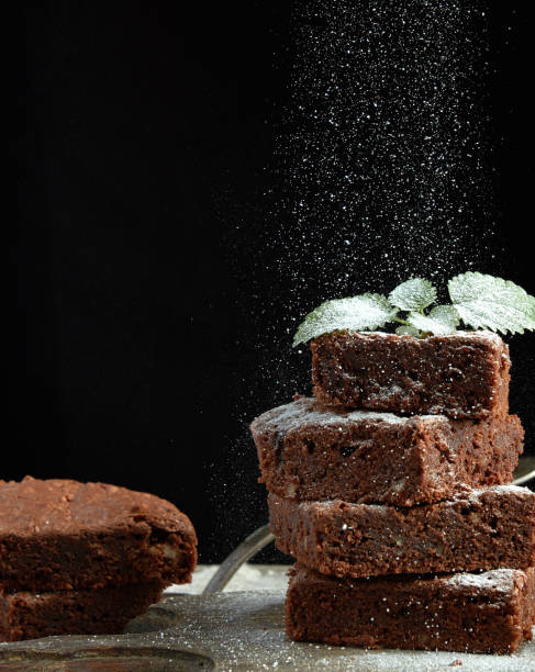 istock stack of square baked brownie chocolate cake slices 1181418947