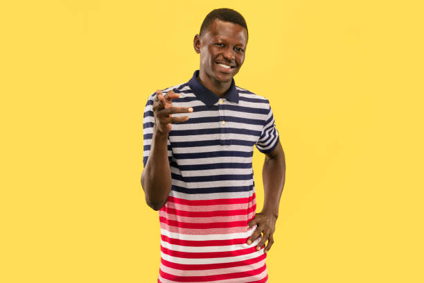istock Young african-american man isolated on yellow studio background, human emotions concept. 1181418955