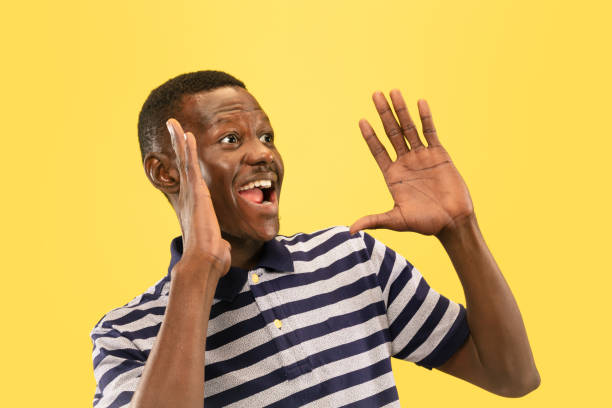 istock Young african-american man isolated on yellow studio background, human emotions concept. 1181419209