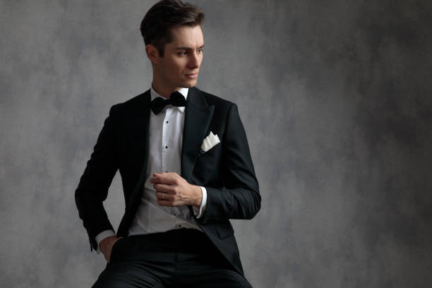 istock young elegant model in tuxedo looking to side 1181420970