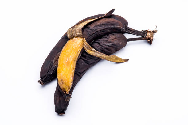 Over ripe (rotten) bananas on white background Over ripe (rotten) bananas on white background. bruised fruit stock pictures, royalty-free photos & images