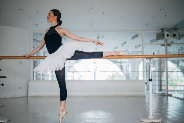 istock Ballerina exercising in dance studio 1181425042