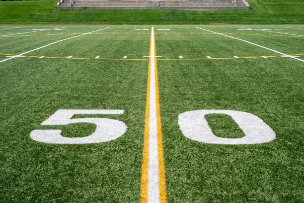 Photo of view of 50 yard line from down on the field