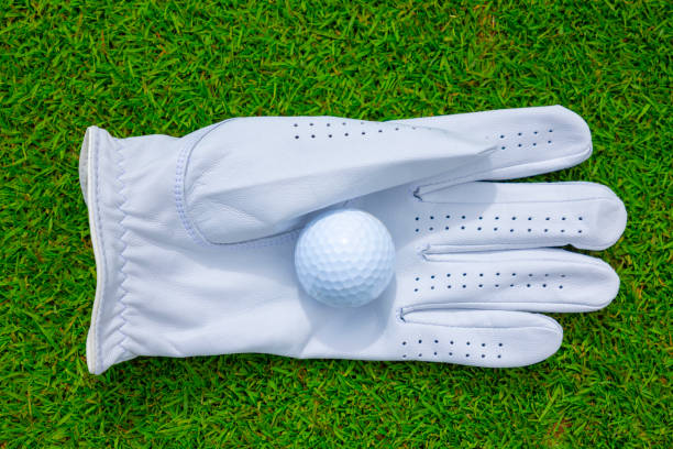 Golf Glove with Golf Ball on the Grass stock photo