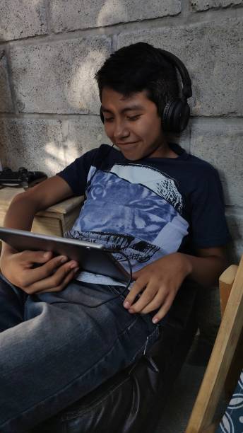 istock Boy mexican use social media 1181429299