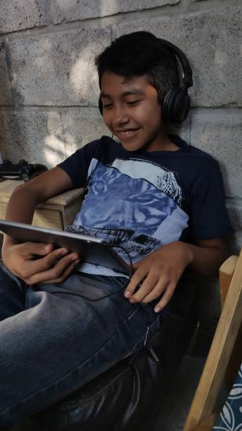 istock Boy mexican use social media 1181429303