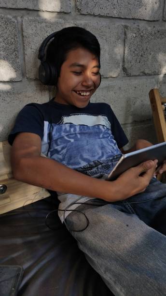 istock Boy mexican use social media 1181429334