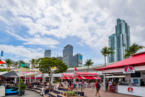 Tourists at Miamarina at Bayside in Downtown Miami, a small deepwater slip marina, with also a space with stores, cafe and restaurants in the Bayside Marketplace.