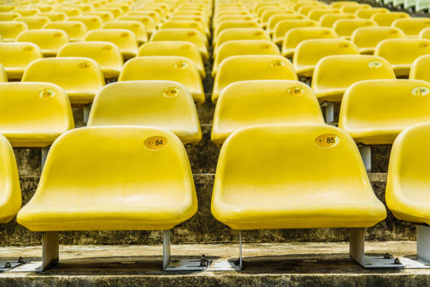 istock yellow empty chairs on the outdoor stadium 1181431091