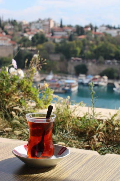 istock glass of turkish tea overlooking antalya old harbour 1181432725