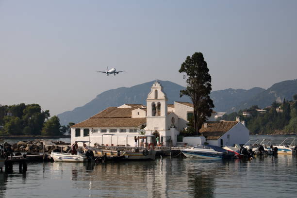 istock jet plane over church in Corfu 1181432765