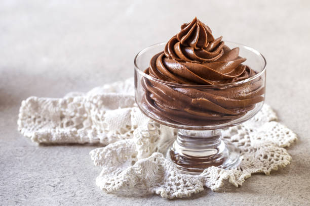 istock chocolate mousse cream in a glass vase on a light background 1181435442