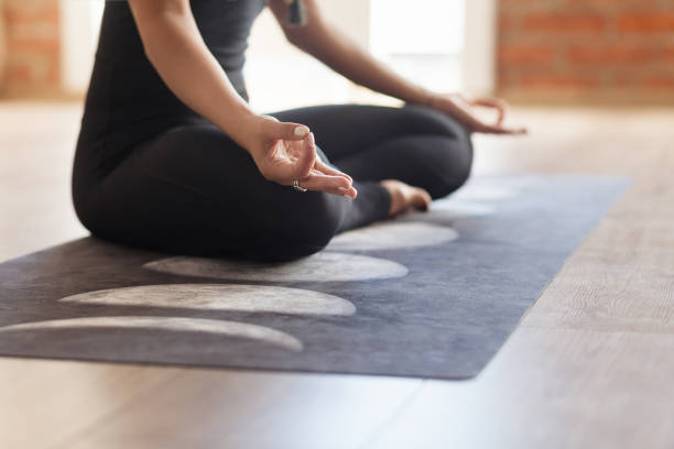 istock Yoga instructor meditates In lotus pose 1181441979