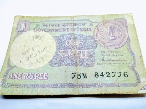 istock A picture of old and rare one rupee note on white background 1181442186