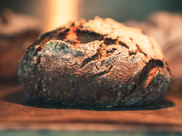 istock foreground of wholemeal rye bread loaf inside the oven 1181442704