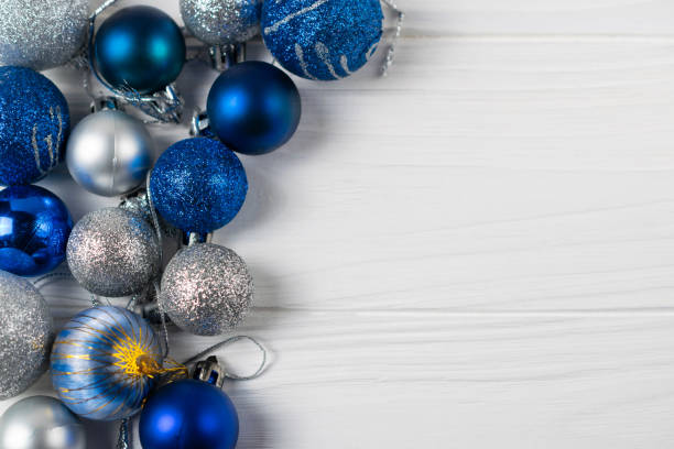 istock Festive background with blue and silver sparkling christmas balls. Flat lay with copy space for your text 1181446622