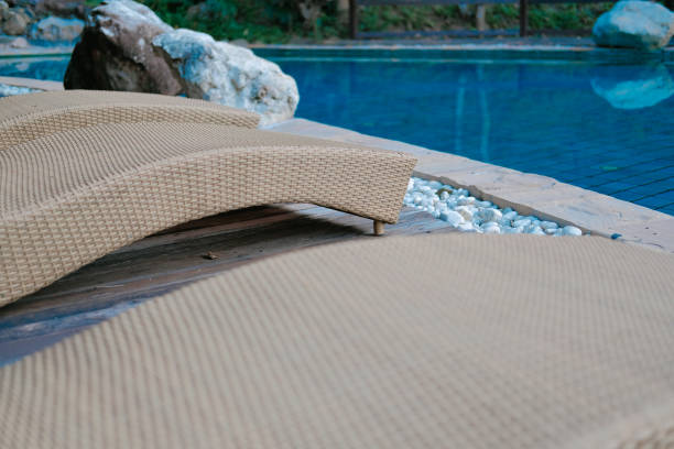 istock wicker rattan pool sun bed deckchair at swimming pool 1181446663