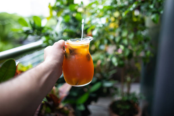 Free Stock Photo of Hand holding a glass of tropical fruit juice ...