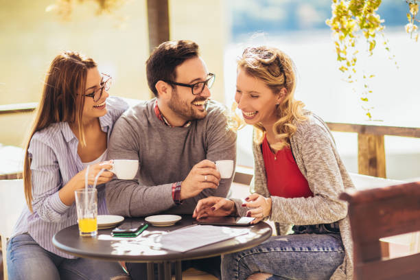 istock Group of friends in cafe, using digital devices 1181446734