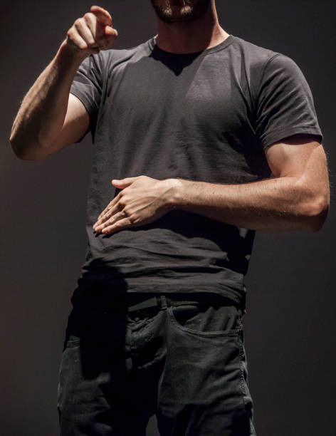 istock Sign language man interpreter gestures over stage during public event 1181447464