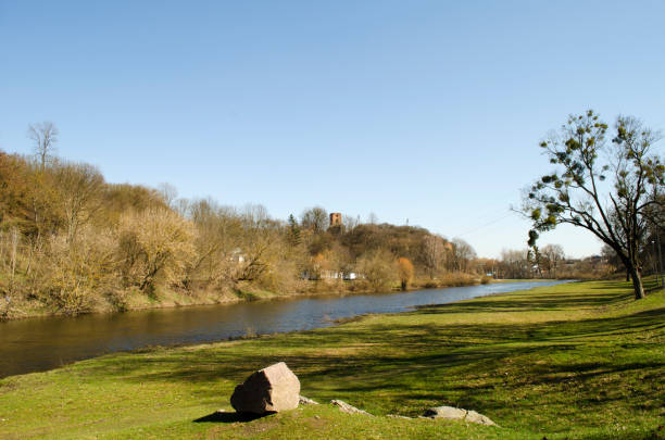 istock Plain river in Europe with a permissible castle on a hill 1181447503