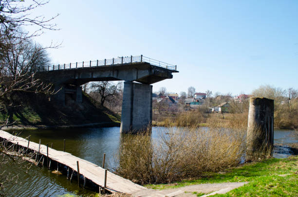 istock ruined bridge across the river 1181447549