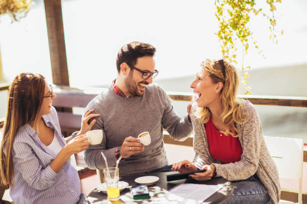 istock Group of friends in cafe, using digital devices 1181448212