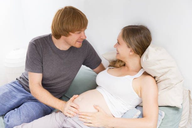 istock Expecting couple enjoying leisure time at home 1181449938