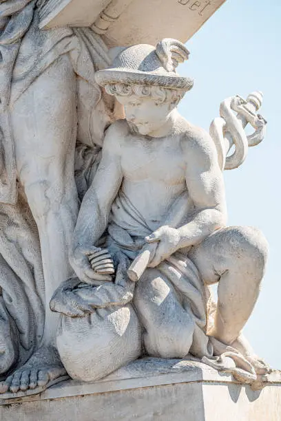 Photo of Sculpture of scientist with a book and his scholar on Zoll Bridge in Magdeburg downtown at direct light background, Germany, details, closeup