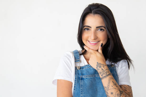istock Smiling young woman looking at camera 1181452375