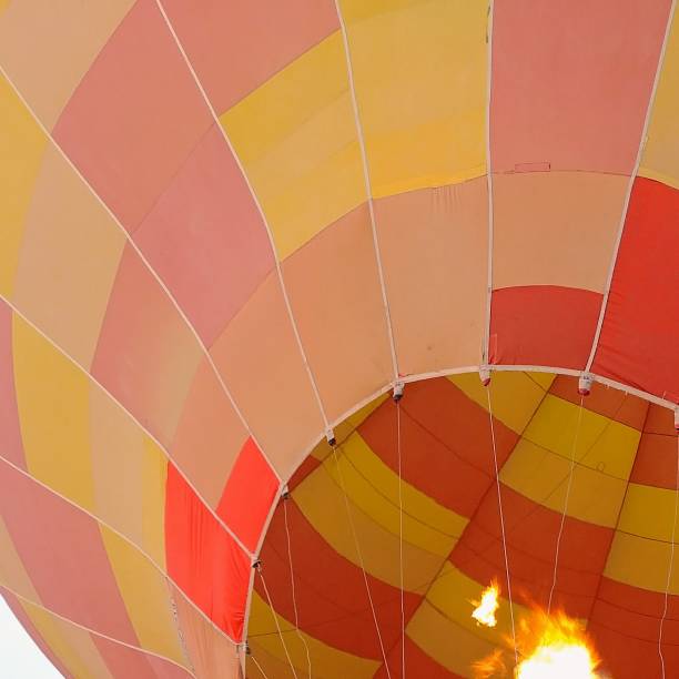 istock Colorful hot air balloon rising into the sky. 1181452421