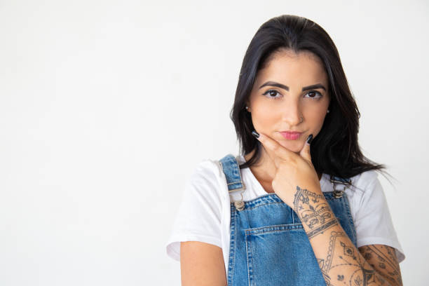 istock Thoughtful young woman looking at camera 1181454505