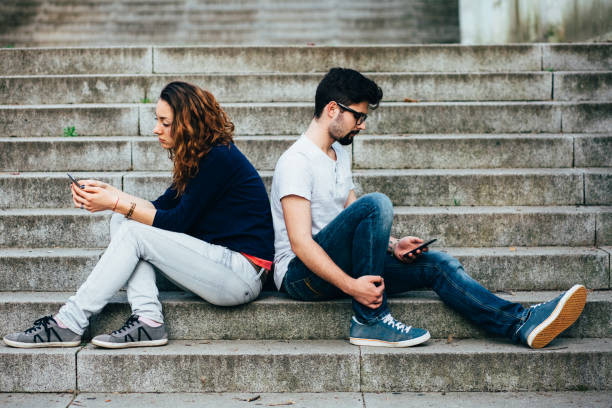 istock Couple after conflict texting on smartphones 1181455210