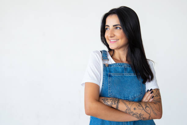 istock Joyful attractive young brunette with crossed arms 1181455400